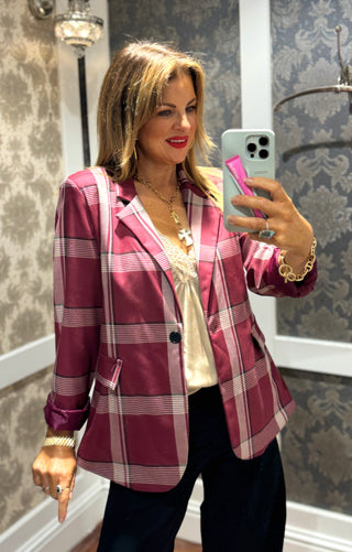Elevate your wardrobe with this tailored chequered red blazer, perfect for making a refined statement. Its tailored look with a classic chequered pattern in bold red adds a touch of sophistication. Ideal for both professional settings and stylish evenings, this blazer merges timeless elegance with modern flair.

