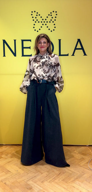 These grey straight leg belted trousers combine timeless elegance with practical warmth, perfect for winter wear. Crafted from a heavy, insulating fabric, they provide comfort against the cold while maintaining a refined silhouette. The tailored belt enhances the elasticated waistline for a polished look, making these trousers an ideal choice for sophisticated seasonal dressing.

